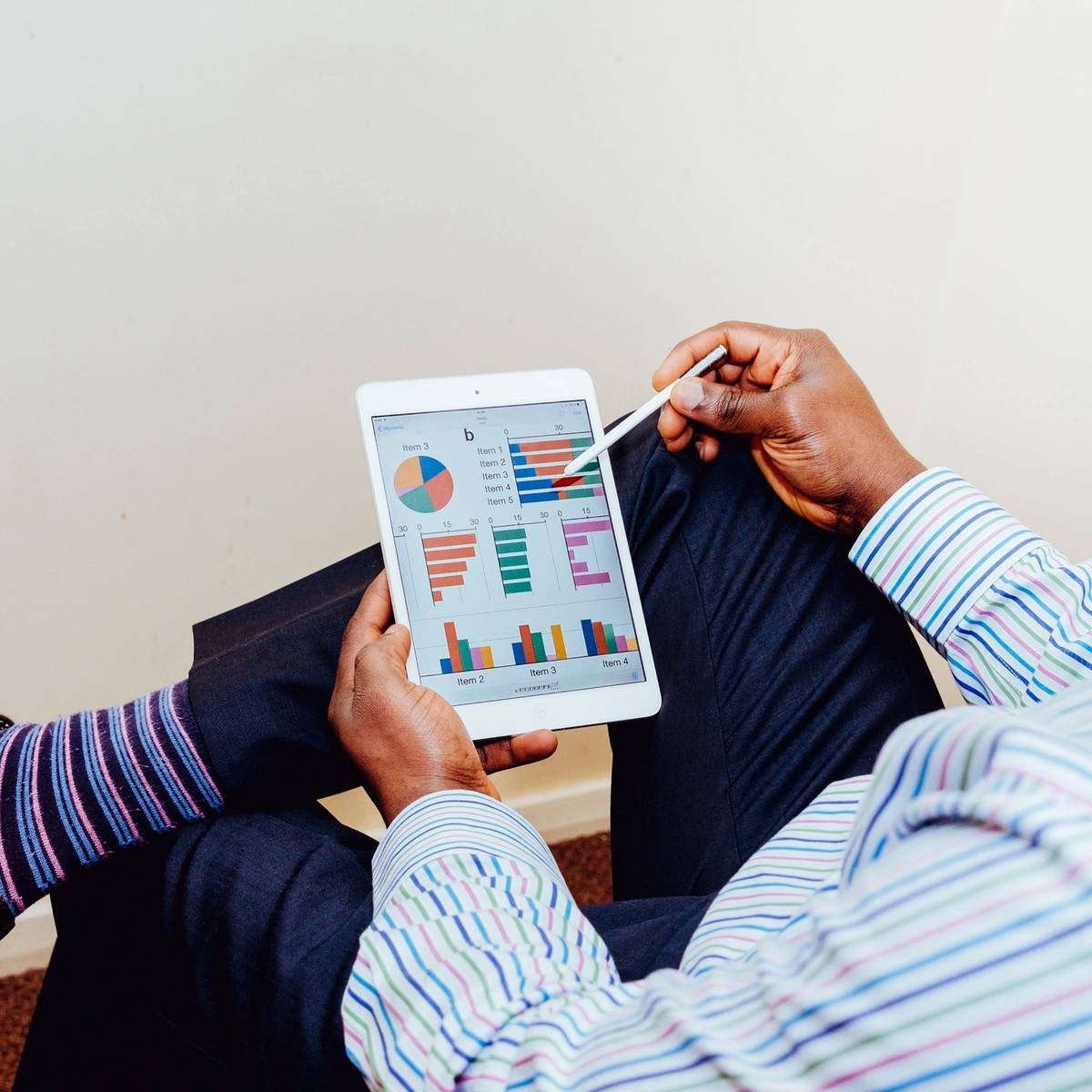 man reading his marketing analytics on a tablet